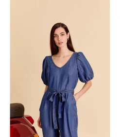Blauwe jumpsuit met strik aan de taille en korte pofmouwen
