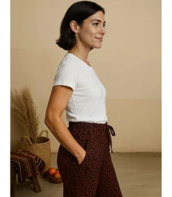 Damesbroek met luipaardprint en strikceintuur