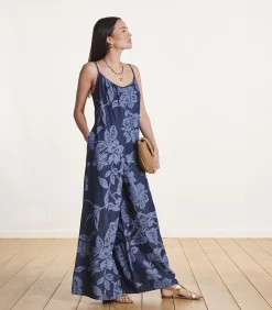 Ruimvallende blauwe jumpsuit met bloemenprint en bandjes
