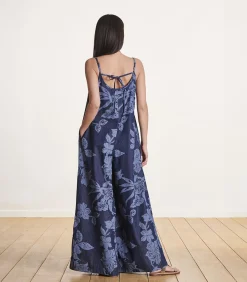 Ruimvallende blauwe jumpsuit met bloemenprint en bandjes