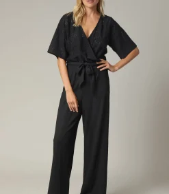 TAYLA - Zwarte crossover-jumpsuit voor dames met mooie mesh