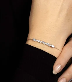 Witgouden armband met diamanten en topaas