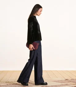 Zwarte fluwelen top met lange mouwen en borduursels